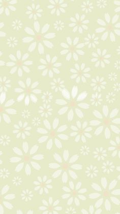 a white flower pattern on a light green background