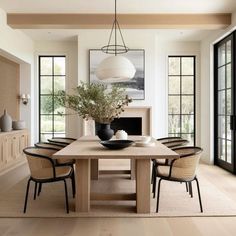 a dining room table with chairs around it