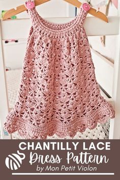 a pink crocheted dress hanging on a wooden hanger with text that reads,'free crochet lace dress pattern by mon petit vilon '