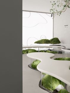 the interior of a modern office with moss growing on the walls and desks,