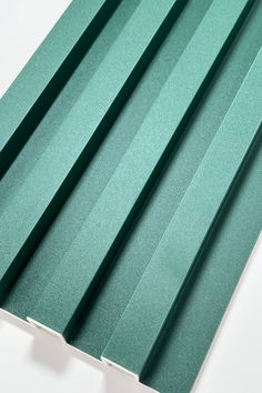 green corrugated roofing sheets on white background