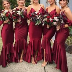 the bridesmaids are all wearing red dresses and holding bouquets in their hands