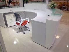 an office cubicle with a desk and chair