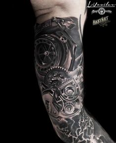 a man's arm with a clock and gears tattoo design on it, in black and white