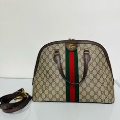 Original Price: $2780 Plus Tax Pre-Owned Gucci Ophidia Medium Top Handle Bag Made In Italy Gold Gg Hardware Detachable And Adjustable Strap Overall Condition: Excellent Gucci Ophidia, Bags Gucci, Gucci Bags, Handle Bag, Gucci Bag, Bag Making, Top Handle, Adjustable Straps, Top Handle Bag