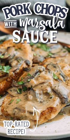 pork chops with masala sauce on a white plate topped with mushrooms and parsley