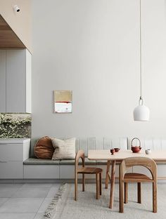 a dining table and chairs in a room