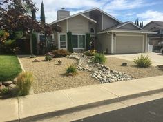 a house with landscaping in front of it