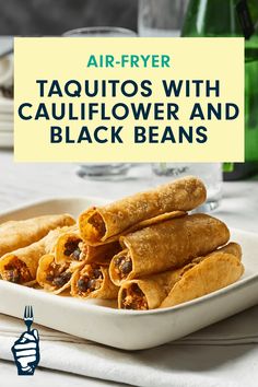 taquitass with cauliflower and black beans on a white platter