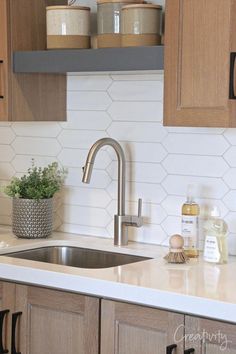 the kitchen sink is clean and ready for us to use in its new home,