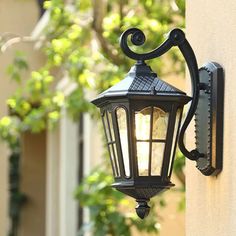 an outdoor light on the side of a building