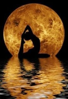 a woman doing yoga in front of the moon