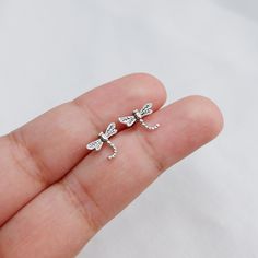 Real 925 Sterling Silver Dainty Tiny Dragonfly Stud Earrings These lovely earrings can be used in Earlobe and Multiple Piercings. Measures 11.5 x 7.5 mm Comes with pushback backings Jewelry will come in a gift box * Please read shop policy before placing an order * *JEWELRY CARE* Sterling Silver will tarnish over time, but to help keep your jewelry looking beautiful - Clean with a soft dry cloth after wear and store inside an airtight bag or container. Remember to remove your jewelry when: * App Silver Nickel-free Cartilage Earrings As Gift, Silver Nickel-free Cartilage Earrings For Gift, Silver Cartilage Earrings As Gift, Sterling Silver Dragonfly Earrings, Silver Sterling Dragonfly Earrings, Silver Sterling Cartilage Earrings Gift, Silver Sterling Silver Cartilage Earrings Gift, Gift Silver Sterling Silver Cartilage Earrings, Silver Drop Cartilage Earrings As Gift