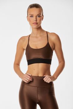 Supportive, sporty, and stylish - meet the Liquid Studio Bra. A scoop neckline and sporty elastic back create the perfect balance between chic and athletic. Now available in Cafe, a beautiful mid-tone brown gloss.