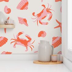 an orange and pink wallpaper with sea animals on it