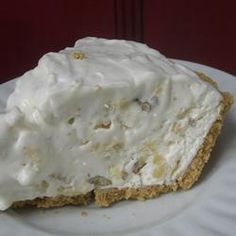 a white plate topped with a piece of cake