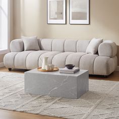 a living room scene with focus on the couch and coffee table