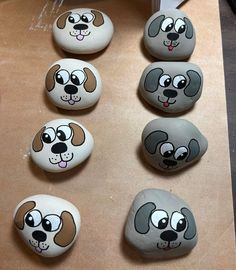 there are many painted rocks with dogs on them