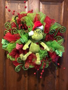 a christmas wreath with an elf's face on it