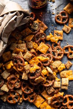 a bag full of cheesy crackers and pretzels on a table