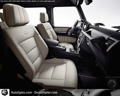 the interior of a vehicle with beige leather seats