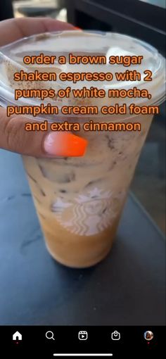 someone is holding up a cup with whipped cream and cinnamon in it that says order a brown sugar shaker espresso with 2 pumps of white mocha, pumpkin cream cold foam,