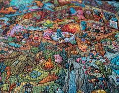 a close up view of a puzzle with many different people on it, all together