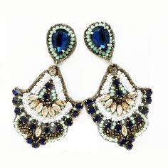 The Feel Like Flirting Statement Earring has a fun flare to them. They are ready for any party or event. The colors are stunning together: blue, white, gold and sea-foam green. Handmade Hypoallergenic Posts Length: 3.75" Width: 2" Post Back Satin Lining Rhinestone & Bead Detailing Jeweled Dangle Beaded Earrings For Party, Bohemian Jeweled Crystal Earrings For Party, Bohemian Blue Earrings For Party, Blue Rhinestone Drop Earrings, Blue Jeweled Teardrop Earrings, Handmade Blue Crystal Earrings For Party, Turquoise Drop Crystal Earrings For Party, Blue Beaded Drop Earrings For Wedding, Elegant Turquoise Beaded Earrings For Party