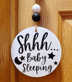 a door hanger that says shh baby sleeping