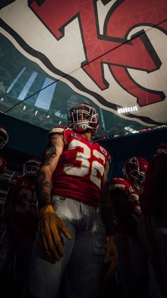 a football player standing in the middle of a tunnel