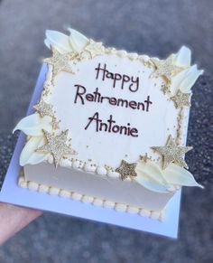 a birthday cake with the words happy retirement antonioe written on it and gold stars