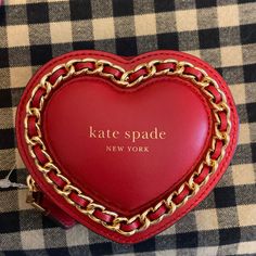 This Kate Spade Coin Wallet In Red Heart Amour Puffy Design Is A Perfect Accessory For Any Casual, Business Or Travel Occasion. It Is A Very Small Size, Measuring 4 Inches In Width, 3.5 Inches In Height And 1.8 Inches In Depth. The Bag Is Made Of Smooth Leather With A Zip-Around Closure And Features A Logo Accent. The Wallet Has A Fabric Lining With A Black Color And Is Spot Cleanable. The Wallet Is Part Of The Amour 3d Heart Product Line. This Wallet Is Perfect For Anyone Who Loves Heart-Shaped Compact Kate Spade Wallets As Gifts, Chic Kate Spade Bag As A Gift, Elegant Kate Spade Bags For Valentine's Day, Kate Spade Leather Wallets As Gift, Chic Red Wallets For Gifts, Compact Red Bags For Gifts, Red Kate Spade Wallets For Everyday Use, Puffy Design, Disney Wallet