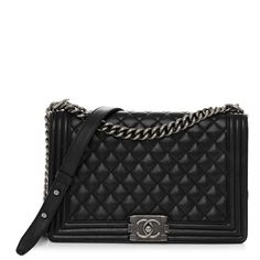 This is an authentic CHANEL Caviar Quilted New Medium Boy Flap in Black. This stylish shoulder bag is crafted of luxuriously soft diamond quilted lambskin leather with linear quilted borders in black. The bag features a ruthenium chain link shoulder strap with a leather shoulder pad and a matching Chanel boy CC push lock. This opens the full flap to a black fabric interior with zipper and flat pockets. High-end Quilted Shoulder Bag For Everyday Luxury, Designer Black Quilted Shoulder Bag, Designer Rectangular Bag With Diamond Quilting, High-end Quilted Bags For Formal Occasions, Timeless Black Quilted Shoulder Bag, Timeless Quilted Black Shoulder Bag, High-end Quilted Formal Bag, Luxury Quilted Rectangular Bag, High-end Formal Quilted Bags