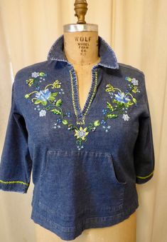 "Hand embroidered and embellished denim fabric shirt. Original freestyle design embroidered by Vermont artist Debbi Wetzel, \" is like painting with thread \" Gloria Vanderbilt label   guesstimate   size M  displayed  on size 20 dress form measures 23\" length  18\" sleeve length and 17\" across back kangaroo pocket across front  buttons ,beads and colorful embroidery threads clean and ready to wear..you will have the only one ! Happy to gift wrap and enclose card upon request sorry no returns" Embroidered Long Sleeve Denim Top For Spring, Embroidered Long Sleeve Denim Top For Summer, Blue Denim Top With Floral Embroidery For Spring, Vintage Embroidered Denim Blue Tops, Embroidered Denim Blue Cotton Tops, Spring Embroidered Cotton Denim Top, Fitted Denim Blue Tops With Floral Embroidery, Fitted Embroidered Medium Wash Tops, Fitted Embroidered Cotton Denim Top