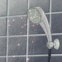 a shower head with water coming out of it