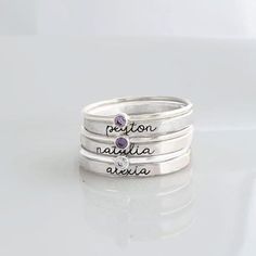 Mother's Day Gift | Personalized stackable ring set, engraved with a name, date, or special word.  Metal: 14 gold filled and .999 fine silver Dimensions: name ring is 2mm tall on average, but our rings are handmade so variations will occur. Birthstones are 2mm on a 1mm band. Font: lowercase cursive Please list names and birthstones from top to bottom order. Unsure what size you need? We highly recommend using our ring sizer for an accurate fit. Some people find that sizing up when stacking 3 or more rings is more comfortable. https://www.etsy.com/listing/239177790/adjustable-ring-sizer-ring-sizing-gauge?click_key=85dd8fd5dd756f82865a0eef53cc0a86ba6f0160%3A239177790&click_sum=58344ebc&ref=shop_home_active_13&pro=1&sts=1 connect with us: http://instagram.com/shopgoinggolden http://www.facebo Mother's Day Adjustable Stackable Rings With Custom Name, Adjustable Stackable Rings With Custom Name For Mother's Day, Sterling Silver Stackable Rings With Custom Name, Personalized Name Sterling Silver Stackable Rings, Personalized Sterling Silver Birthstone Ring For Wedding, Customizable Silver Birthstone Ring For Wedding, Silver Birthstone Ring With Names In Sterling Silver, Silver Sterling Birthstone Ring With Names, Elegant Silver Stackable Rings With Custom Name