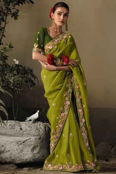 Emanate charm and sophistication at your next celebration with our Trendy Embroidered Border Work Saree with Designer Blouse. This exquisite attire made from superior fancy silk, not only offers absolute comfort but adds an opulent charm to your attire. The embellished border work takes this piece to a new height of fashion. Pair it with the included matching fancy silk blouse to bring out the timeless appeal. Add this stunning ensemble to your wardrobe today. Woven Stitch, Wedding Wear Saree, Lehenga Gown, Trendy Sarees, Pattern Embroidery, Wear Saree, Green Sequins