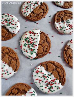 six cookies with white frosting and sprinkles