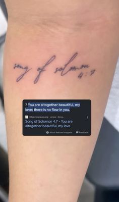 a person with a tattoo on their leg that says, you are altogether beautiful my books there is no few in you