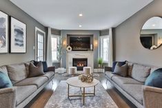 a living room filled with furniture and a fire place