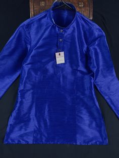 Short Kurta Only Item : Men's Short Kurta Ready to Wear : Yes Kurta Color : Royal Blue Color Fabric : Raw Silk Pocket : Yes PLEASE GO BY THE MEAUREMENTS BELOW. Measurement Details : Size : 38Chest Measurement - 40 inchesShoulder Measurement - 18 inchesLength : 31 inchesSize : 40Chest Measurement - 44 inchesShoulder Measurement - 19 inchesLength : 31 inchesSize : 42Chest Measurement - 46 inchesShoulder Measurement - 20 inchesLength : 33 inchesSize : 44Chest Measurement - 48 inchesShoulder Measure Casual Blue Kurta For Festive Occasions, Blue Casual Kurta For Festive Occasions, Blue Casual Festive Kurta, Casual Blue Festive Kurta, Blue Festive Casual Kurta, Royal Blue Fitted Long Sleeve Kurta, Fitted Royal Blue Long Sleeve Kurta, Ethnic Wear Indian Men, Mens Ethnic Wear