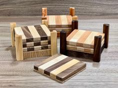 four pieces of wood sitting on top of a wooden floor