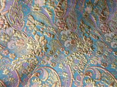 an ornate blue and pink paisley print fabric