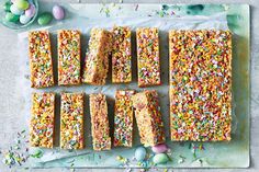 an assortment of candy bars with sprinkles and eggs