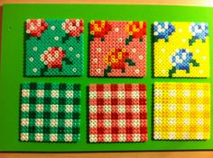 the four squares are made out of perler beads and have different designs on them