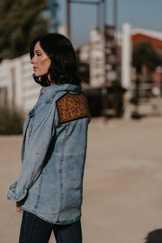 Add a touch of western flair to your denim pearl snap. Tooled leather back patch. Full pearl snap front. Runs true to size. Material: 100% Cotton Small (2/4) | Medium (6/8) | Large (10/12) | XL (14/16) **denim washed shirts will vary in color slightly as they are all unique mineral washed** Western Style Denim Jacket For Rodeo In Fall, Western Style Denim Jacket For Rodeo, Western Style Long Sleeve Denim Jacket, Western Style Denim Blue Jacket For Fall, Western Style Medium Wash Denim Jacket, Western Blue Denim Jacket For Fall, Fitted Western Denim Jacket, Fitted Western Denim Jacket For Rodeo, Fitted Denim Jacket For Rodeo