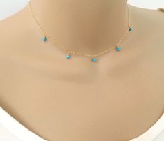 Turquoise Necklace, Dangling Bead Necklace, Choker Necklace, Minimal Necklace, Gemstone Necklace, Dainty Necklace, Layering Necklace, Tiny Stone Necklace, Gift Idea Available in 14k Gold Fill or Sterling Silver, this necklace is composed of a dainty chain with 5 stations of 2-3mm faceted turquoise beads freely dangling, with a spring ring clasp closure. Looks great combined with other length chains. Matching gold filled/sterling silver asymmetrical earrings also available. This set can be made w Dainty Turquoise Pendant Necklace, Turquoise Dangle Charm Necklaces As Gift, Turquoise Dangle Charm Necklaces For Gifts, Dainty Blue Turquoise Necklace With Adjustable Chain, Dainty Turquoise Necklace With Clavicle Chain, Dainty Turquoise Clavicle Chain Necklace, Dainty Turquoise Dangle Jewelry, Ankle Bracelets Boho, Dainty Necklace Layered