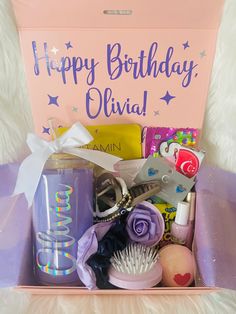 a pink birthday gift box filled with personal care items