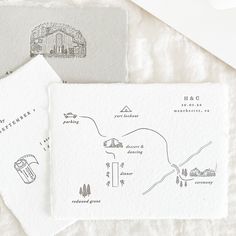 two envelopes with hand drawn maps on them