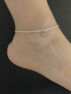 Sterling Silver  Bulldog AnkletMinimalist and Dainty Beaded Dog Anklet ANKLET FEATURES:Metal:  All components are made from solid .925 Sterling Silver Model is wearing 10" in length  solid .925 Sterling Silver Bead ChainChain Length:  10 inchesYour Dainty Beaded  Bulldog Anklet will arrive in a gift box, beautifully wrapped and ready for giftingPlease send me a message if you have any questions before or after placing your order. Please also view my policy before purchasing. ******************** Silver Beaded Anklets As Gift, Silver Beaded Anklets For Gift, Adjustable Bracelet Anklets For Wedding, Adjustable Wedding Anklets, Beaded Anklets With Ankle Strap As Gift, Beaded Anklets With Ankle Strap For Gifts, Beaded Silver Ankle Wrap Anklet, Silver Beaded Ankle Wrap Anklet, Ankle Wrap Anklets With Tiny Beads For Gifts